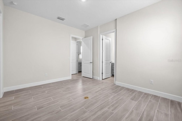 33750 Ocean Spray Ln, Wesley Chapel, FL 33543 - unfurnished bedroom featuring light wood-style flooring and baseboards