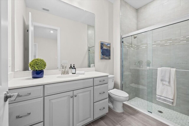 33750 Ocean Spray Ln, Wesley Chapel, FL 33543 - full bathroom with a stall shower, vanity, and toilet