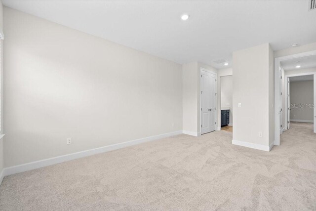 33750 Ocean Spray Ln, Wesley Chapel, FL 33543 - spare room featuring light colored carpet, baseboards, and recessed lighting