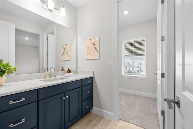 33750 Ocean Spray Ln, Wesley Chapel, FL 33543 - bathroom featuring vanity, baseboards, and tile patterned floors
