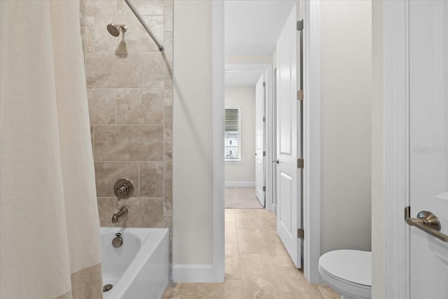 33750 Ocean Spray Ln, Wesley Chapel, FL 33543 - full bathroom featuring tile patterned flooring, toilet, shower / tub combo, and baseboards