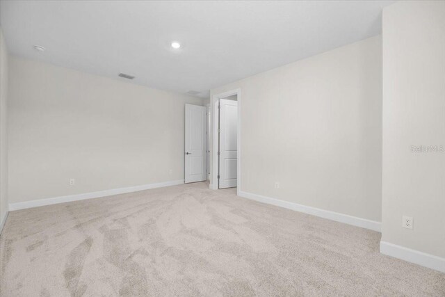 33750 Ocean Spray Ln, Wesley Chapel, FL 33543 - spare room with light carpet, baseboards, and recessed lighting