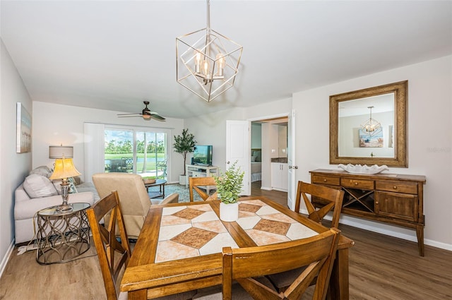 6151 Bahia Del Mar Blvd Unit 126, Saint Petersburg, FL 33715 - dining area with wood finished floors, baseboards, a ceiling fan, and a chandelier
