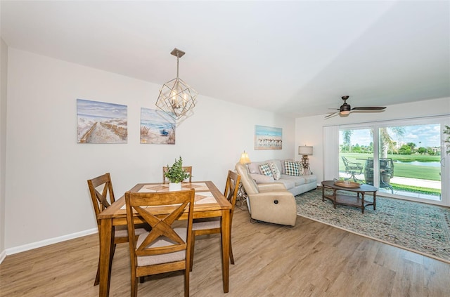6151 Bahia Del Mar Blvd Unit 126, Saint Petersburg, FL 33715 - dining room with light wood finished floors, ceiling fan, a chandelier, and baseboards