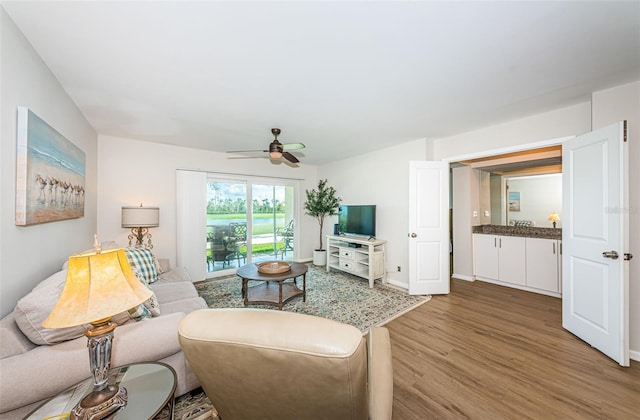 6151 Bahia Del Mar Blvd Unit 126, Saint Petersburg, FL 33715 - living area featuring wood finished floors, a ceiling fan, and baseboards