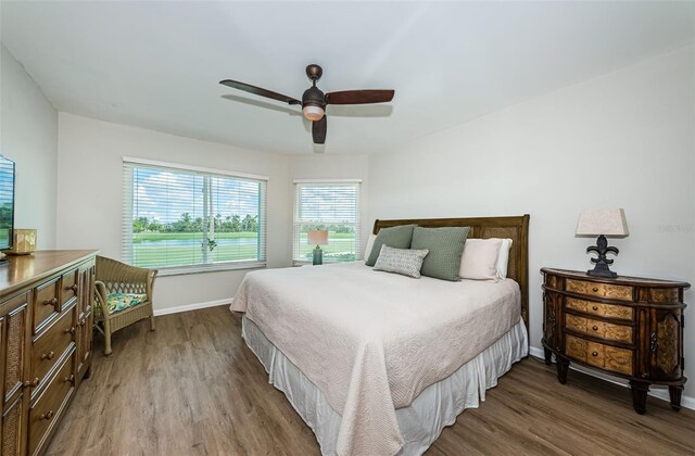 6151 Bahia Del Mar Blvd Unit 126, Saint Petersburg, FL 33715 - bedroom with wood finished floors, baseboards, and ceiling fan
