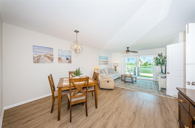 6151 Bahia Del Mar Blvd Unit 126, Saint Petersburg, FL 33715 - dining room with light wood-style floors, a chandelier, and baseboards