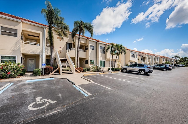 6151 Bahia Del Mar Blvd Unit 126, Saint Petersburg, FL 33715 - view of property featuring uncovered parking, a residential view, and stairway