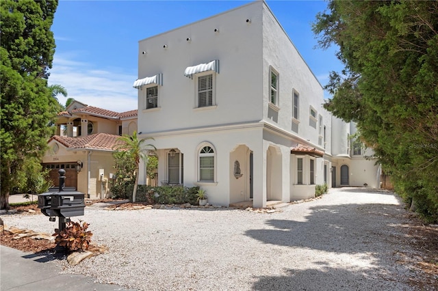 2936 W Knights Ave Unit A, Tampa, FL 33611 - view of front of home featuring stucco siding and driveway