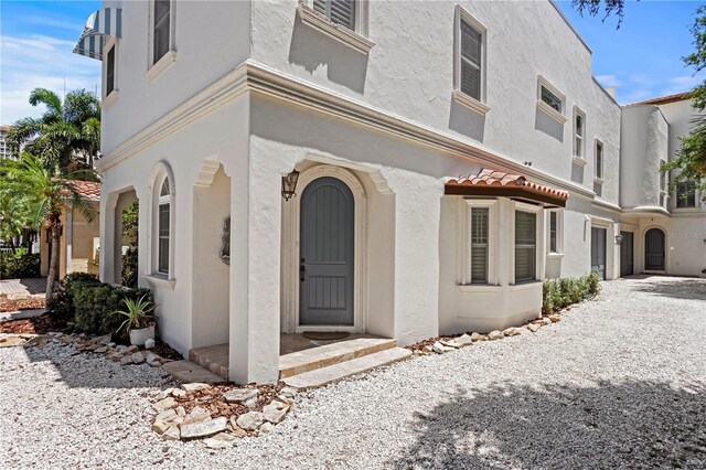 2936 W Knights Ave Unit A, Tampa, FL 33611 - view of front of house featuring stucco siding and a tiled roof