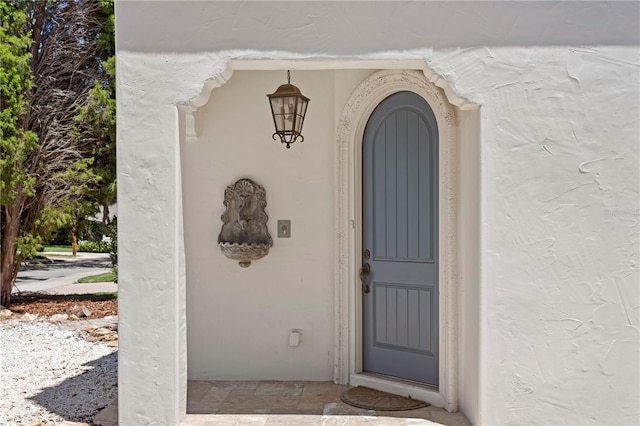 2936 W Knights Ave Unit A, Tampa, FL 33611 - doorway to property featuring stucco siding