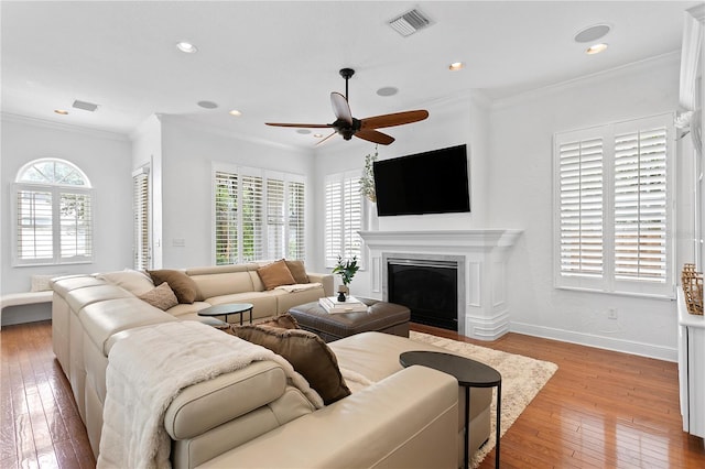2936 W Knights Ave Unit A, Tampa, FL 33611 - living area with light wood-style floors, ceiling fan, baseboards, a fireplace, and recessed lighting