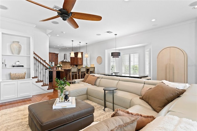2936 W Knights Ave Unit A, Tampa, FL 33611 - living area with light wood-type flooring, stairway, ceiling fan, ornamental molding, and recessed lighting