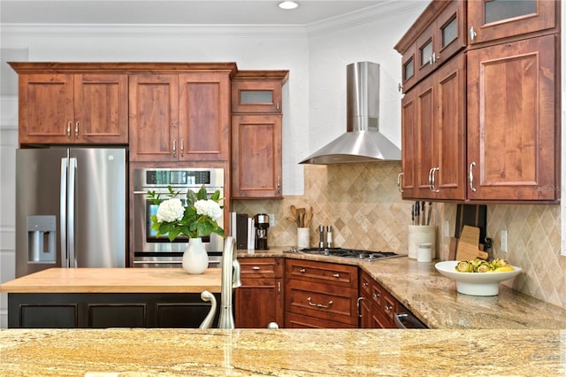 2936 W Knights Ave Unit A, Tampa, FL 33611 - kitchen featuring wall chimney range hood, stainless steel appliances, glass insert cabinets, backsplash, and crown molding
