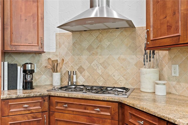 2936 W Knights Ave Unit A, Tampa, FL 33611 - kitchen with wall chimney exhaust hood, stainless steel gas cooktop, tasteful backsplash, and light stone counters