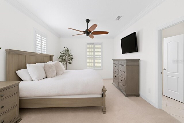 2936 W Knights Ave Unit A, Tampa, FL 33611 - bedroom featuring crown molding, light carpet, ceiling fan, and baseboards