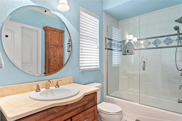 2936 W Knights Ave Unit A, Tampa, FL 33611 - bathroom with bath / shower combo with glass door, vanity, and toilet