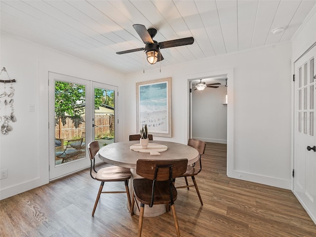 3305 10th Ave N, Saint Petersburg, FL 33713 - dining space featuring a ceiling fan, wood finished floors, baseboards, crown molding, and wood ceiling