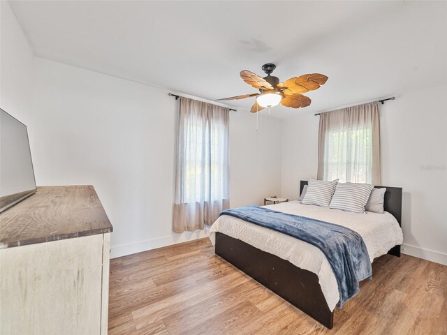 3305 10th Ave N, Saint Petersburg, FL 33713 - bedroom featuring light wood finished floors, baseboards, and a ceiling fan