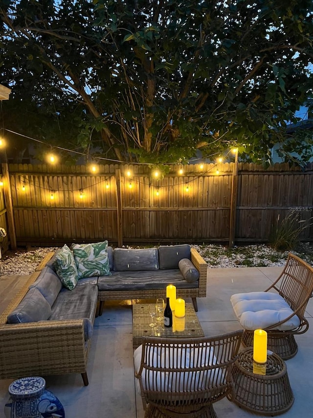 3305 10th Ave N, Saint Petersburg, FL 33713 - fenced backyard featuring an outdoor hangout area and a patio area