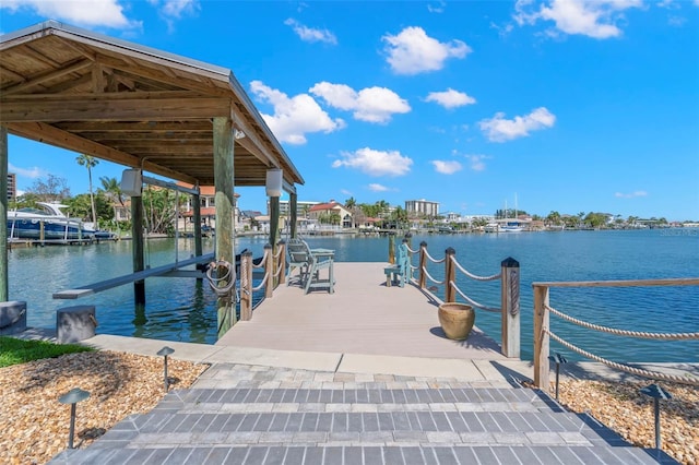 106 Midway Is, Clearwater Beach, FL 33767 - dock area with boat lift and a water view