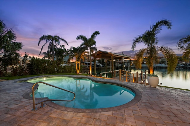 106 Midway Is, Clearwater Beach, FL 33767 - pool at dusk featuring an outdoor pool and a patio area