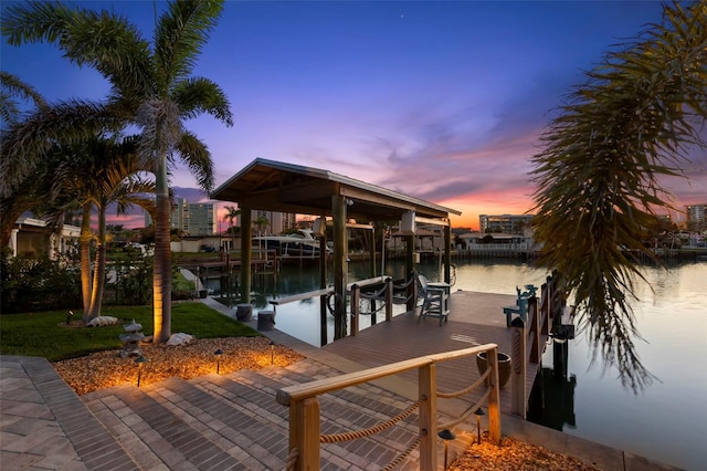 106 Midway Is, Clearwater Beach, FL 33767 - dock featuring boat lift, a water view, and a yard