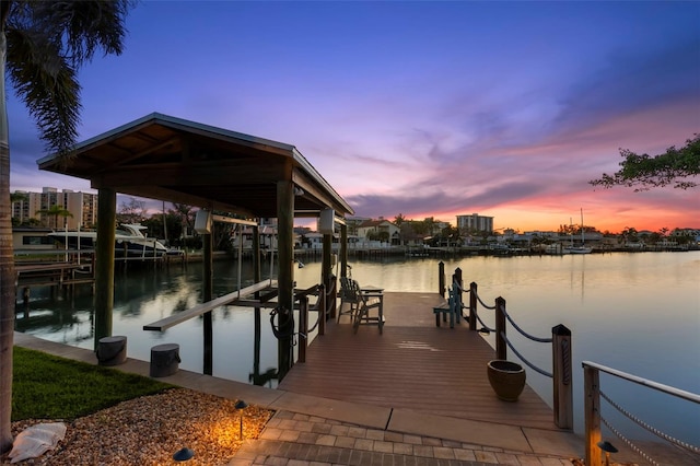 106 Midway Is, Clearwater Beach, FL 33767 - dock featuring boat lift and a water view