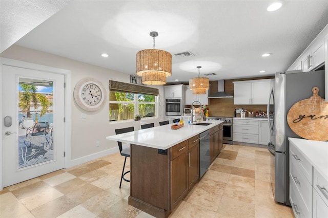 106 Midway Is, Clearwater Beach, FL 33767 - kitchen with wall chimney exhaust hood, appliances with stainless steel finishes, decorative backsplash, light countertops, and recessed lighting