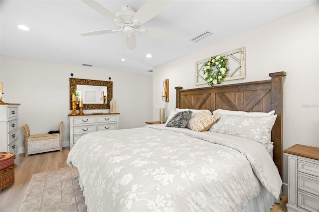 106 Midway Is, Clearwater Beach, FL 33767 - bedroom with light wood finished floors, recessed lighting, and ceiling fan