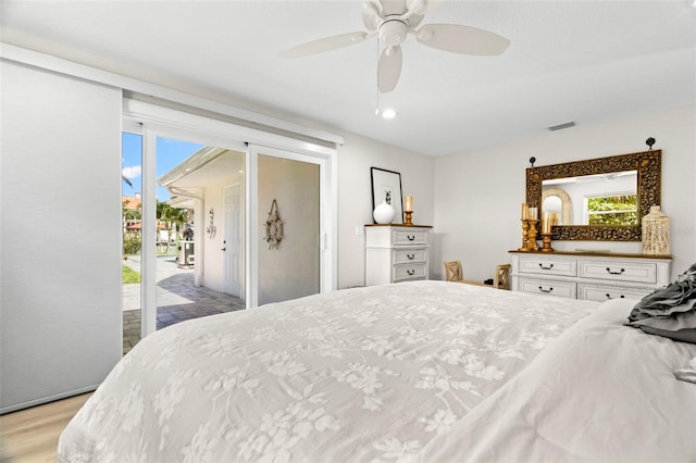 106 Midway Is, Clearwater Beach, FL 33767 - bedroom with access to exterior, multiple windows, light wood-style floors, and ceiling fan