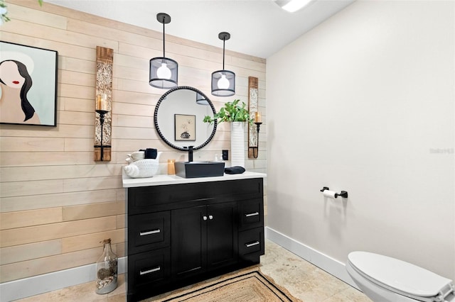 106 Midway Is, Clearwater Beach, FL 33767 - half bathroom with wooden walls and vanity