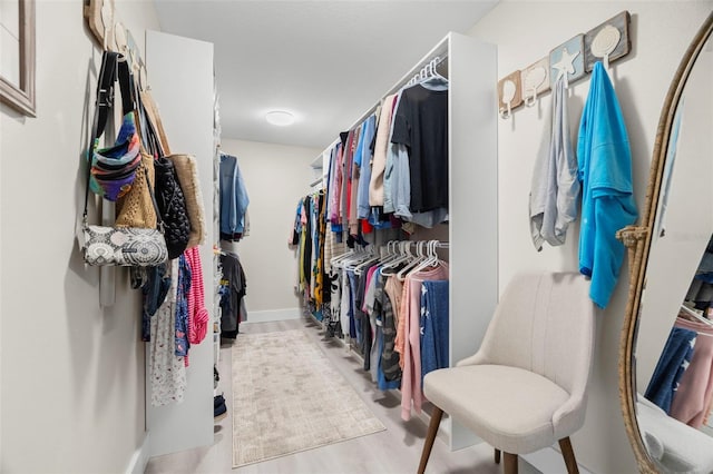 106 Midway Is, Clearwater Beach, FL 33767 - walk in closet with wood finished floors