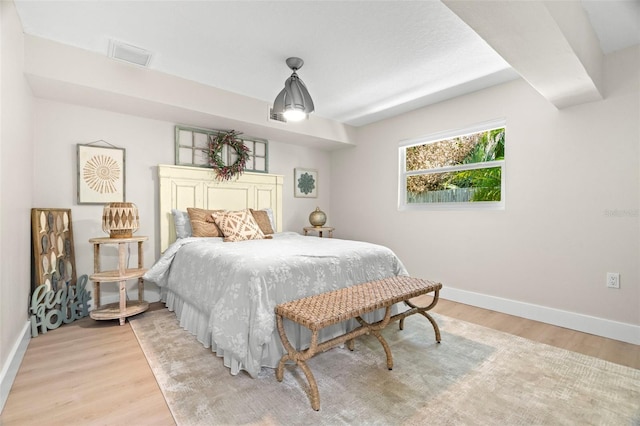 106 Midway Is, Clearwater Beach, FL 33767 - bedroom featuring baseboards and light wood-style flooring