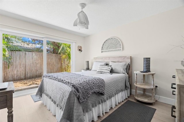106 Midway Is, Clearwater Beach, FL 33767 - bedroom with access to exterior and baseboards