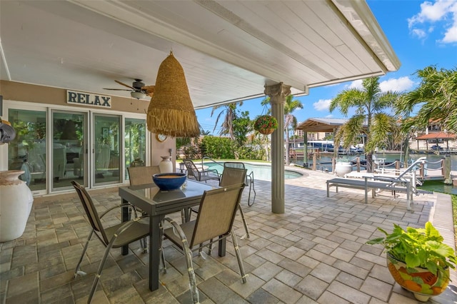 106 Midway Is, Clearwater Beach, FL 33767 - view of patio / terrace with a ceiling fan, an outdoor pool, and outdoor dining area