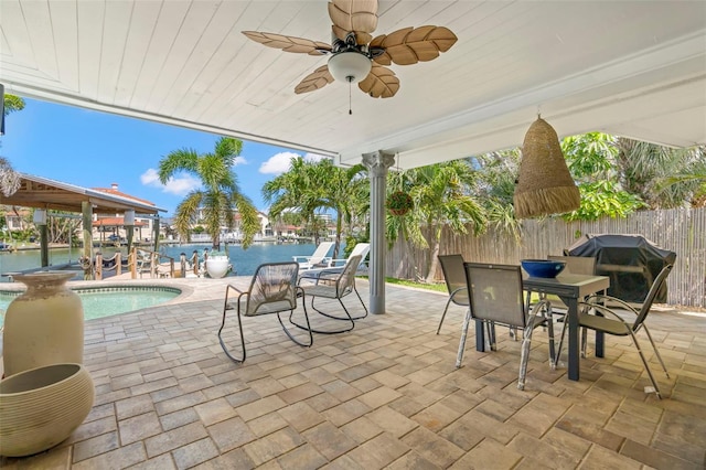 106 Midway Is, Clearwater Beach, FL 33767 - view of patio / terrace featuring ceiling fan, a water view, outdoor dining area, and a grill