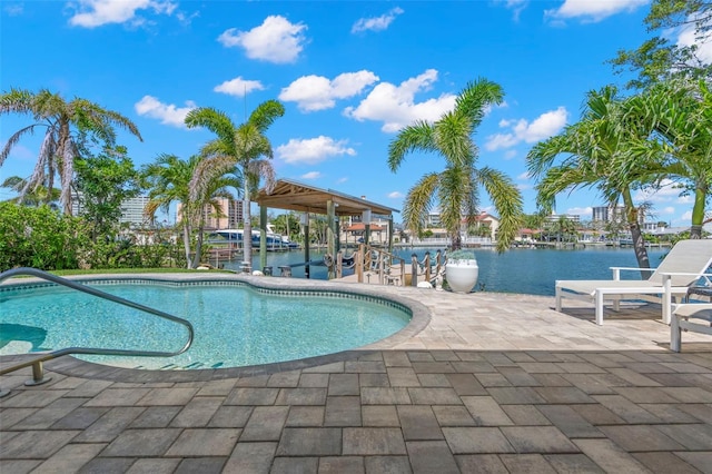 106 Midway Is, Clearwater Beach, FL 33767 - swimming pool featuring a water view and a patio area