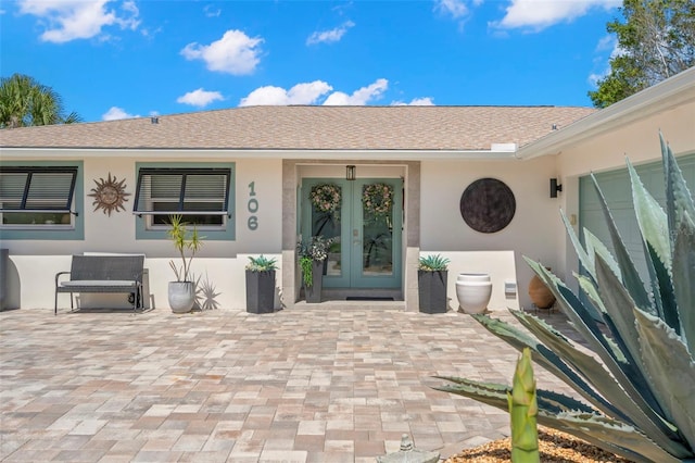 106 Midway Is, Clearwater Beach, FL 33767 - entrance to property with french doors and stucco siding
