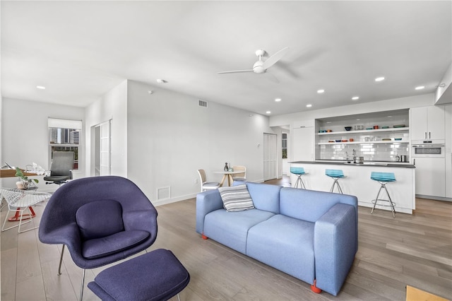 205 5th Ave N Unit 501, Saint Petersburg, FL 33701 - living room featuring a ceiling fan, light wood finished floors, recessed lighting, and baseboards