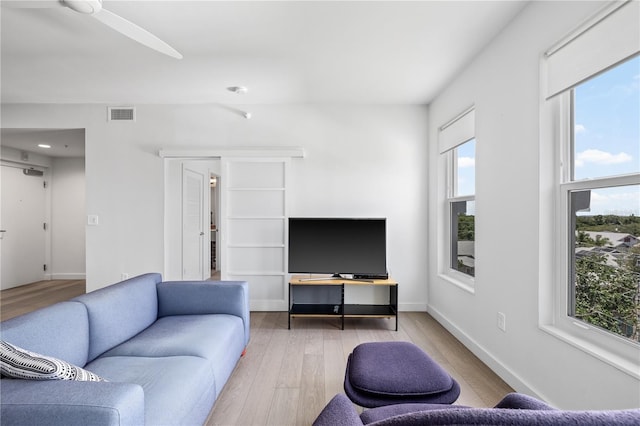 205 5th Ave N Unit 501, Saint Petersburg, FL 33701 - living area with healthy amount of natural light, wood finished floors, and baseboards