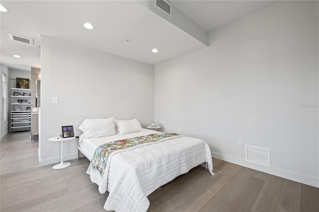 205 5th Ave N Unit 501, Saint Petersburg, FL 33701 - bedroom with wood finished floors, baseboards, and recessed lighting