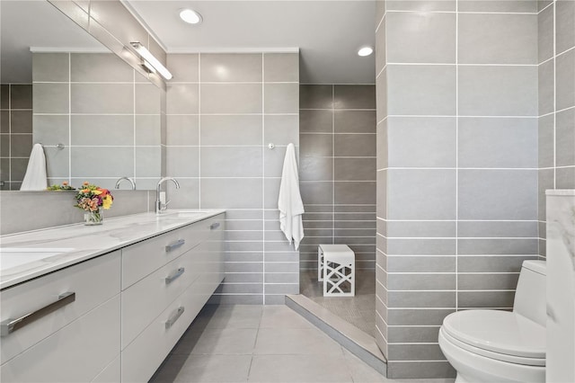 205 5th Ave N Unit 501, Saint Petersburg, FL 33701 - bathroom featuring tile walls, toilet, tile patterned floors, double vanity, and recessed lighting