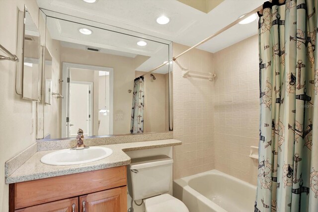 14561 El Paseo Dr, Seminole, FL 33776 - full bath with vanity, shower / bathtub combination with curtain, recessed lighting, and toilet