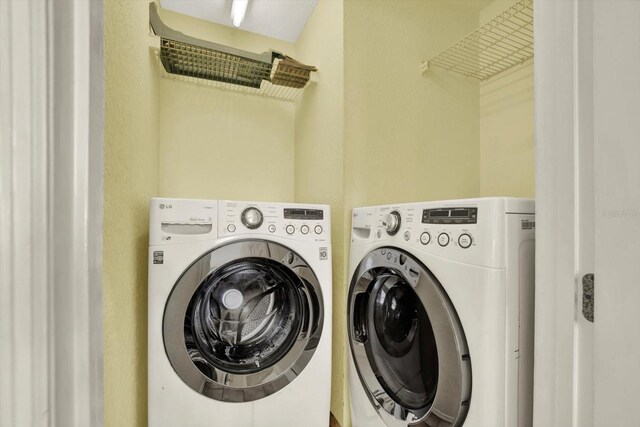 14561 El Paseo Dr, Seminole, FL 33776 - laundry area featuring washer and dryer
