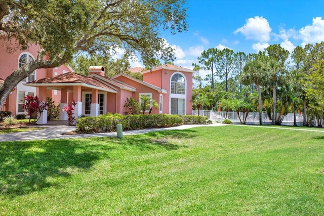 14561 El Paseo Dr, Seminole, FL 33776 - mediterranean / spanish-style home featuring stucco siding and a chimney