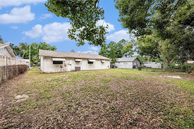rear view of house with cooling unit