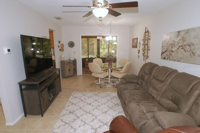 1126 Tarridon Ct, Dunedin, FL 34698 - living room with light tile patterned floors and ceiling fan