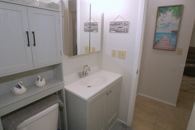 1126 Tarridon Ct, Dunedin, FL 34698 - bathroom with vanity, tile patterned flooring, toilet, and baseboards