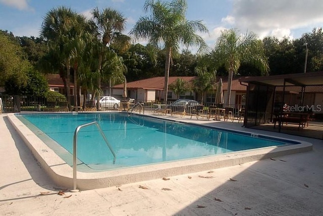 1126 Tarridon Ct, Dunedin, FL 34698 - community pool featuring fence